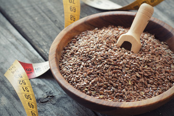 Flax seeds  and measuring tape,  weight reduction concept