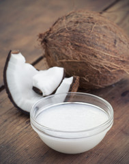 Coconuts and organic coconut oil in a glass jar