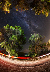 Milky Way. Beautiful summer night sky with stars, sea and rocks.