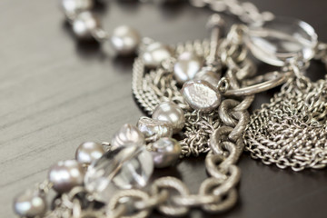 Assorted silver costume jewellery with a jumbled pile