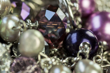 Close up of three attractive shiny purple beads
