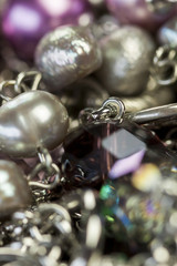 Close up of three attractive shiny purple beads