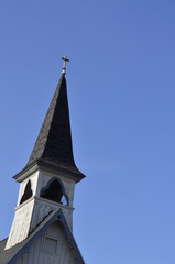 Fototapeta na wymiar Old and weathered church steeple and belfry