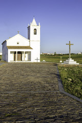 Fototapeta na wymiar Church in Luz New Village, built in 2002. Portugal