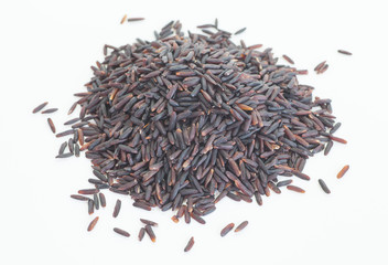Uncooked brown rice on a white background