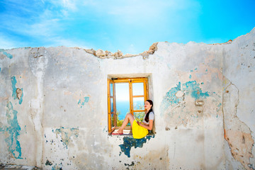 Woman sitting on the window