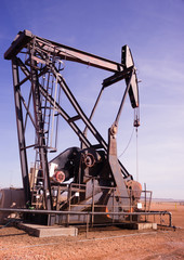 Fototapeta na wymiar Texas Oil Pump Jack Fracking Crude Extraction Machine