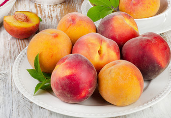 Fototapeta na wymiar fresh peaches on a wooden table