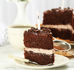 Delicious chocolate cake on table on light background