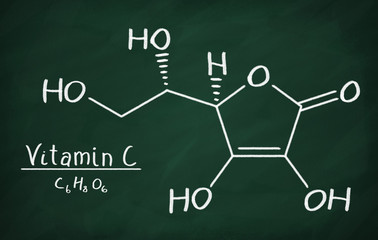 Chemical formula of Vitamin C on a blackboard