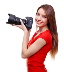 Young female photographer taking photos isolated on white