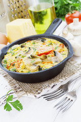 Omelet with mushrooms and tomatoes. Frittata