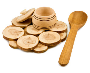 wooden spoon and  bowl on a board on a white background