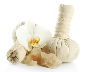 Fototapeta na wymiar Composition with massage bags, sea salt and orchid flower, isolated on white