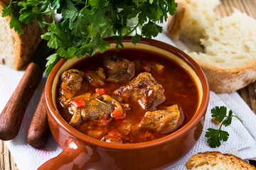 Meat stew in ceramic pot