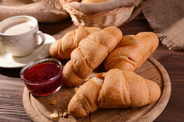 Delicious croissants on table close-up