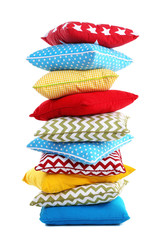Stack of colorful pillows isolated on white