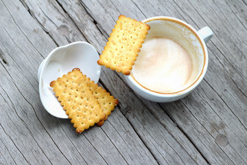latte coffee in glass and crackers