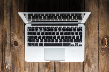 Open laptop on a wooden desk