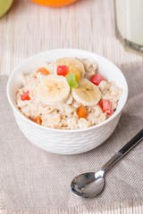 Oatmeal with candied fruils and milk