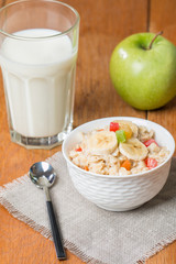 Oatmeal with candied fruils and milk