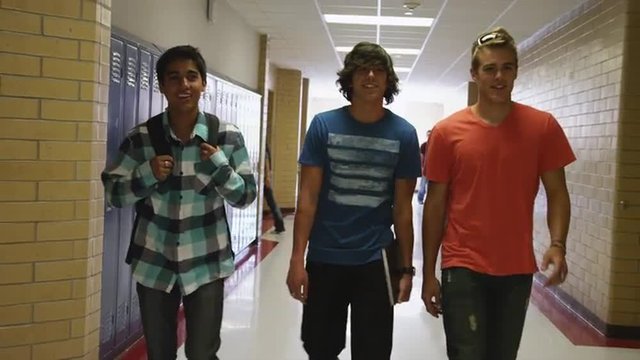 MS Three male students walking down school corridor / Spanish Fork City, Utah, USA