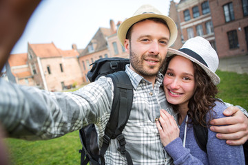 Young couple on holidays taking selfie