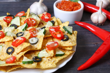 Mexican hot nachos with vegetables and chili