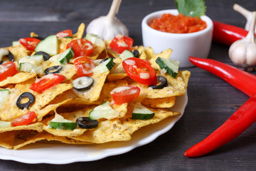 Mexican hot nachos with vegetables and chili