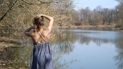 Beautiful sunny girl near river