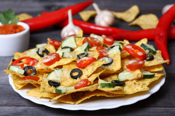 Mexican hot nachos with vegetables and chili