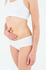 Fototapeta premium Fit woman suffering from stomach pain