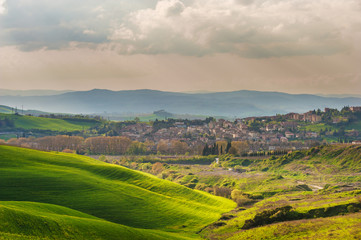 Fototapeta na wymiar Tuscan spring countryside and the city of Torrenieri