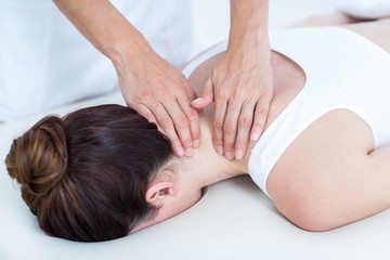 Fototapeta na wymiar Physiotherapist doing neck massage