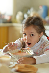  Little girl eating soup