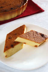 Two slices of cheesecake with raisins