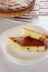 Two slices of cheesecake with raisins