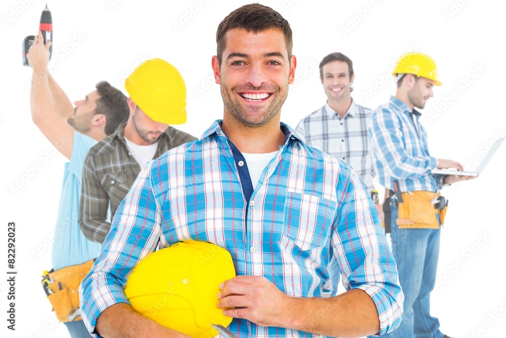 Aufkleber composite image of smiling handyman holding hardhat and hammer