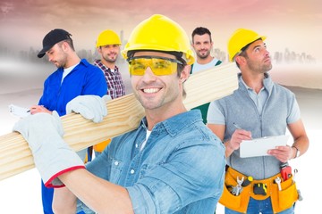 Composite image of carpenter wearing hardhat and glasses