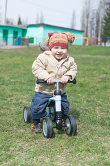 little boy riding runbike