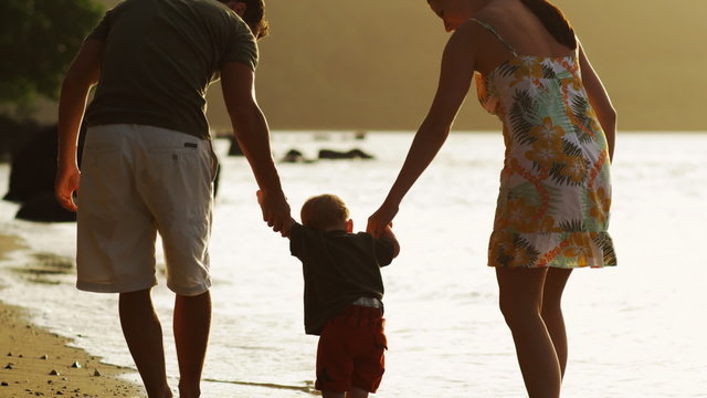 family walking on the beach