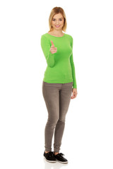 Young woman pointing on camera.