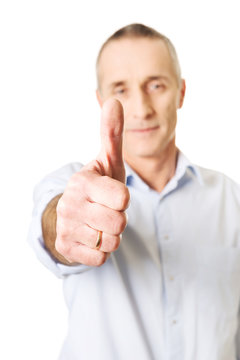 Mature man gesturing ok sign