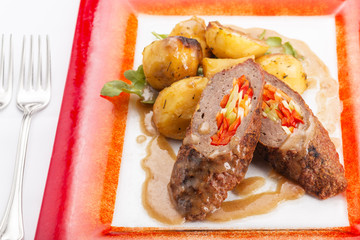 Rolled and stuffed meat in restaurant