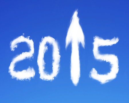 2015 arrow up sign shape white clouds on blue sky