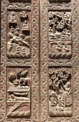 Wooden door with scenes from life of Buddha, Kathmandu, Nepal