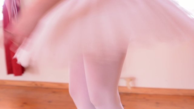 young ballerina dancing in the hall - detail of skirt