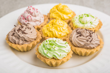 Cupcakes with colorful sweet cream