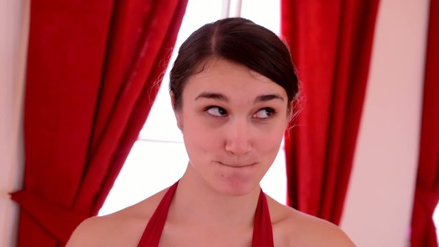 young attractive woman doing funny grimaces - closeup