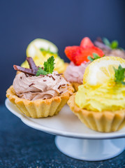 Small biscuits with fruits and sweet cream